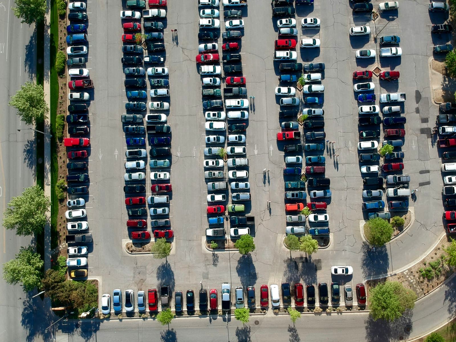 Aerial view of a commercial parking lot with landscaped islands